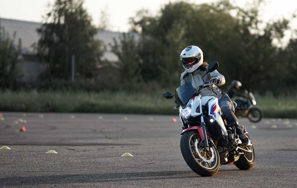 New motorcycle rider riding around cones