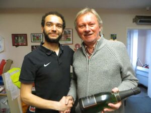 Dave McCourt, right, presents a Harrow Borough player with a man-of-the-match award