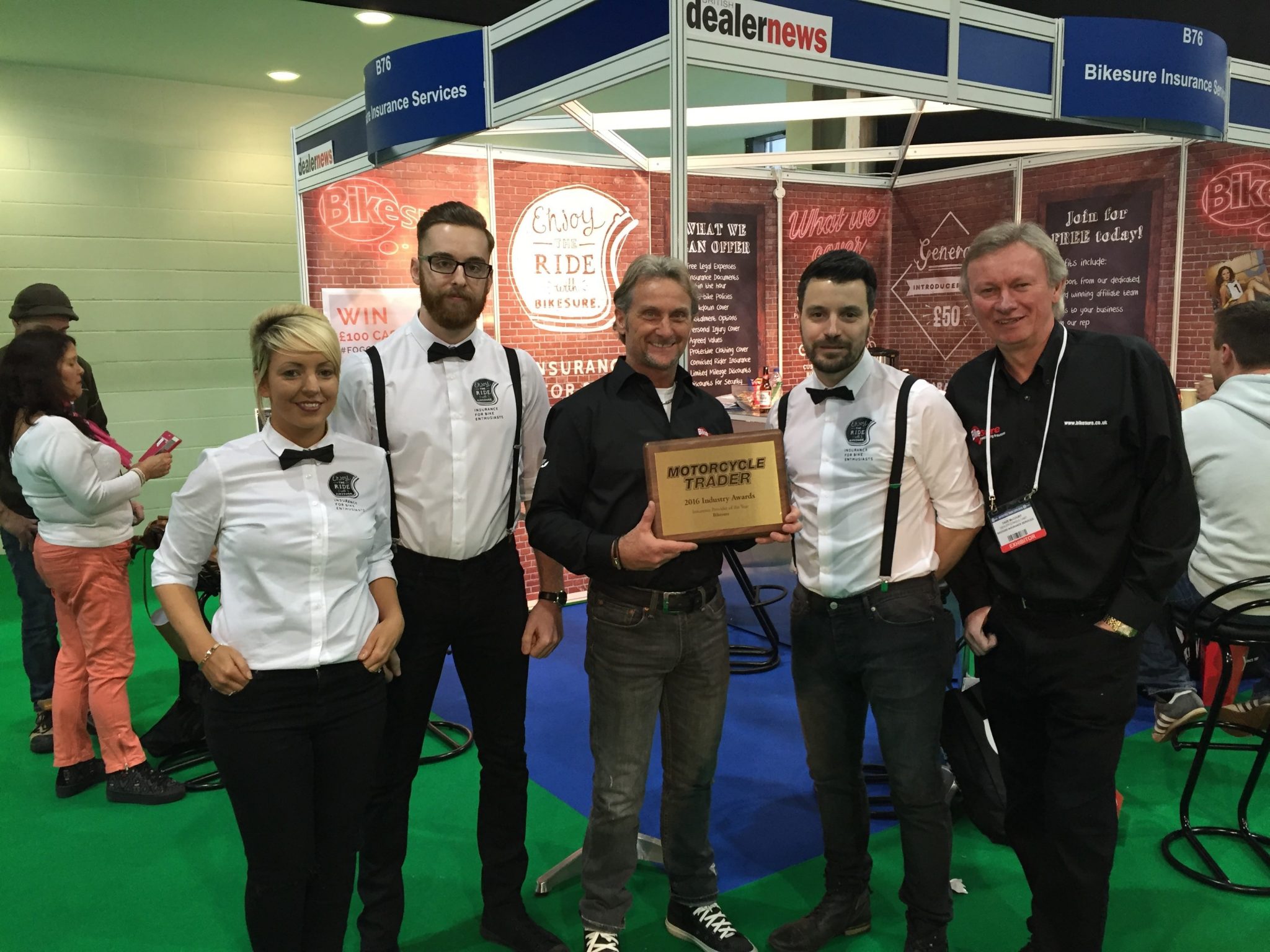 Dave McCourt, far right, celebrates an award with some of his Bikesure colleagues