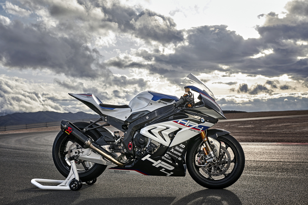 A BMW HP4 sitting in front of rolling clouds