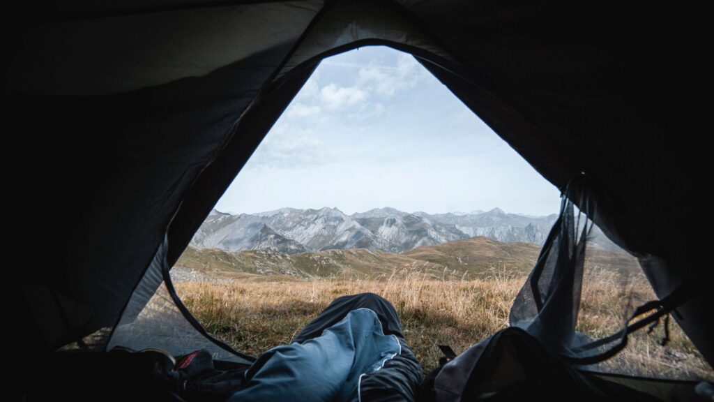 Someone sleeping in their tent with a beautiful view on a camping trip