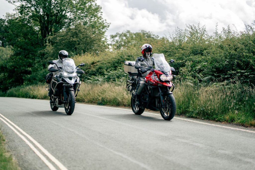 Two bikers riding together in Wales