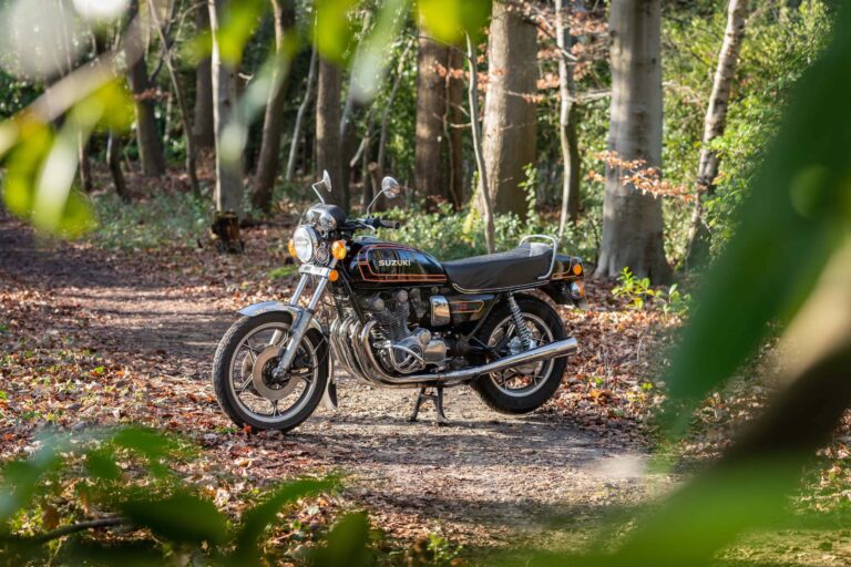 Suzuki GS850G parked outside with trees in the background