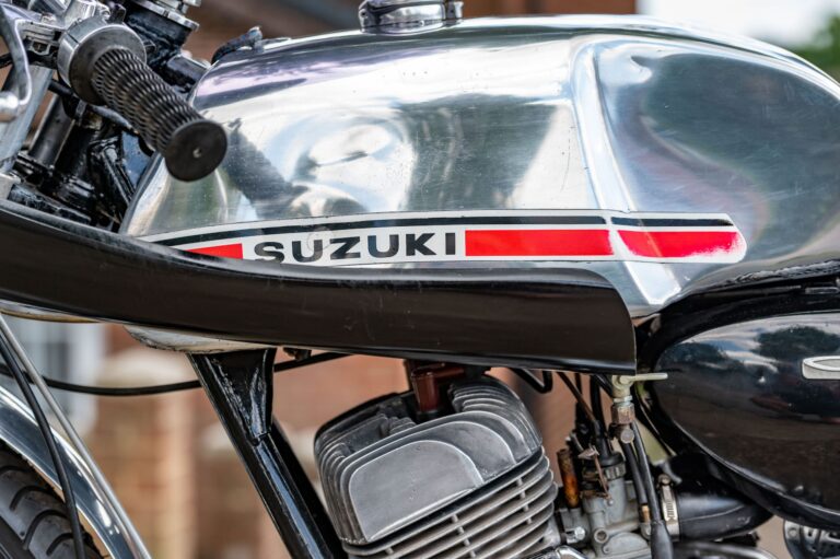 Suzuki T200 aluminium tank with dent clearly visible