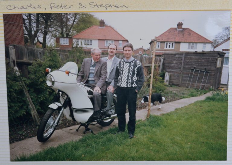 Peter (middle) with dad Charles and brother Stephen (right) alongside the Triumph